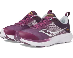 Saucony Ride KDZ Kids Quick - release running in a train station area shoes
