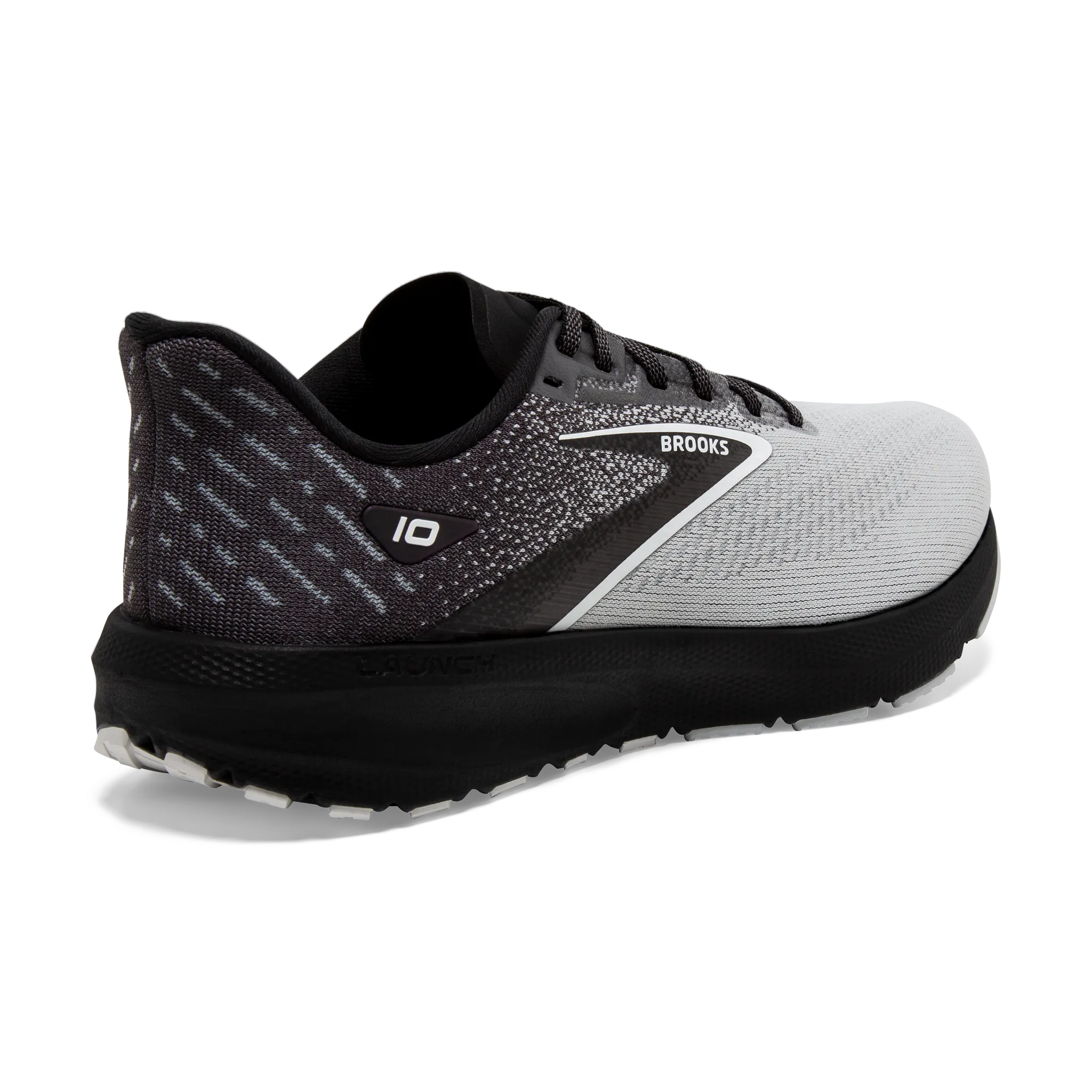 Men's Launch 10 running in a meadow shoes